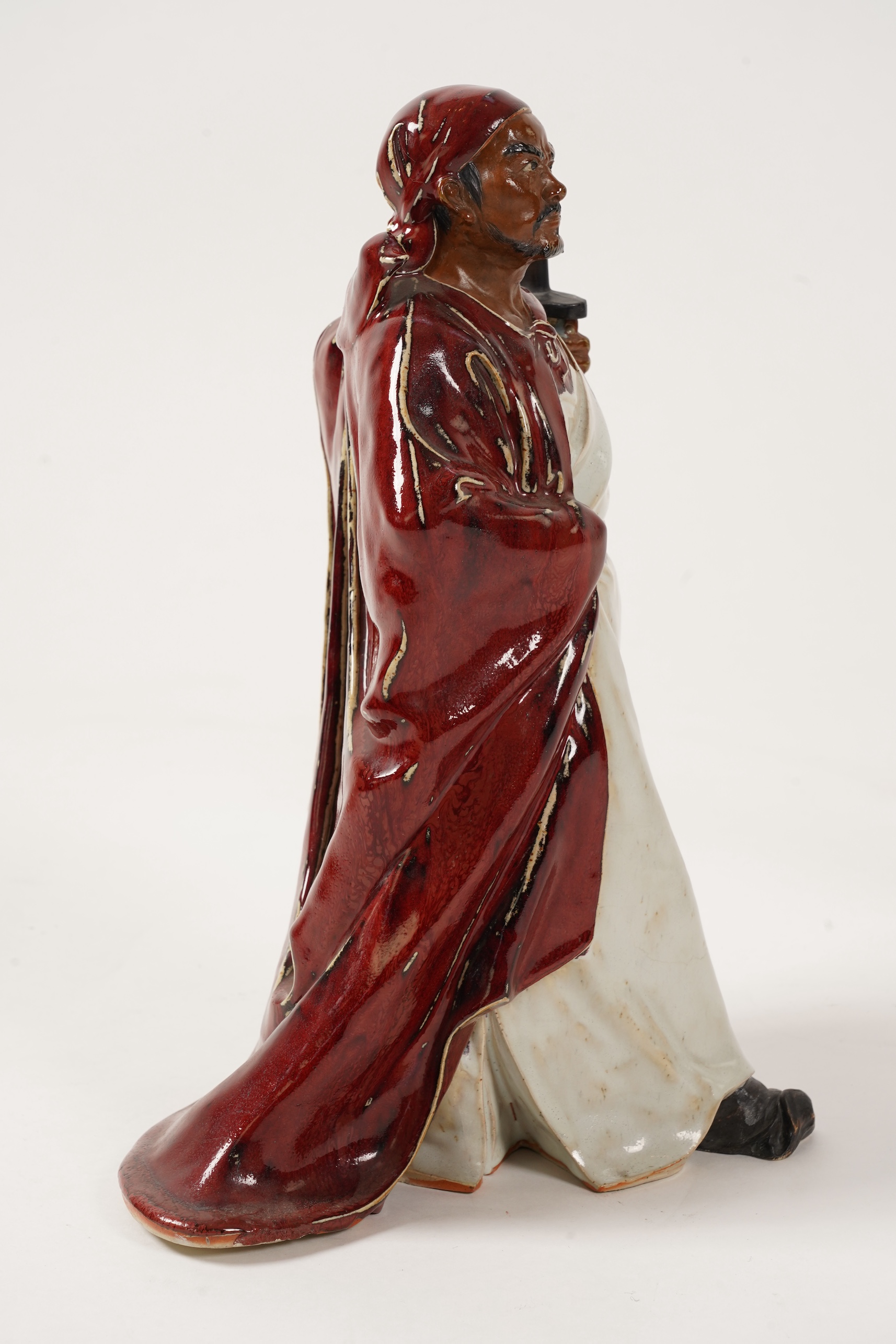 A large Chinese Shiwan stoneware figure of a warrior, 20th century